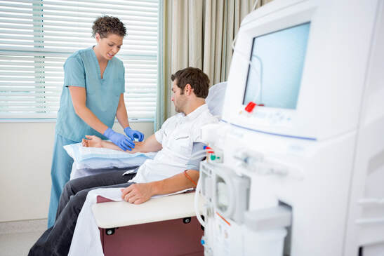 A nephrologist prepares a patient for dialysis treatment